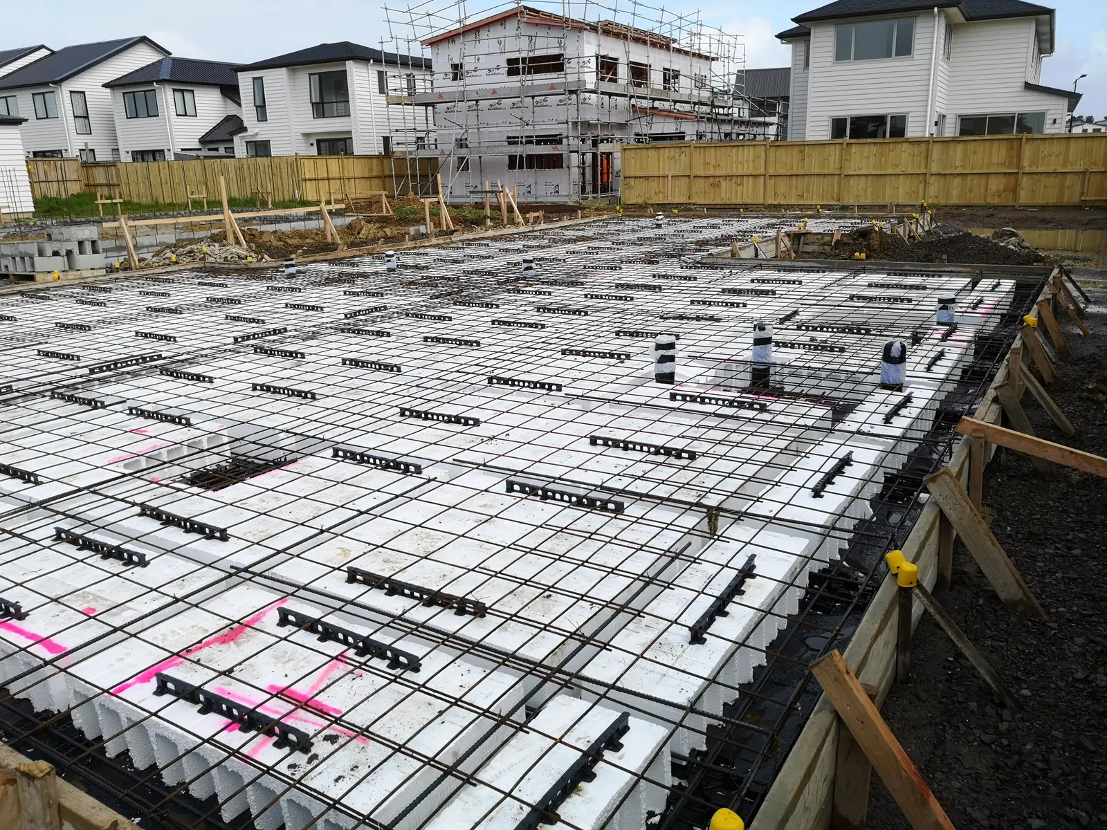 Rib raft foundation with polystyrene pods and steel mesh ready for the concrete pour